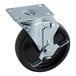 A black wheel with a metal plate for a Continental Refrigerator.