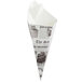 A Carnival King newspaper cone with newspaper on it.