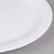 A close-up of a white Carlisle Dallas Ware melamine plate.