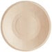 A close-up of a TreeVive by EcoChoice wooden plate with a circle in the middle.