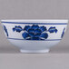 A white melamine bowl with blue lotus flowers on it.