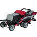 A red and black Foundations Trio Sport stroller with canopies over the seats and a storage basket.