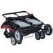 A red and black Foundations Quad Sport stroller with two seats and wheels.
