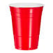 A close up of a red Solo plastic cup with a white lid.