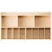 A natural wood wall-mount diaper organizer with 11 compartments.