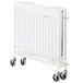 A white Foundations StowAway EasyRoll folding crib with wheels.