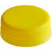 A yellow plastic bottle cap.