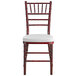 A Lancaster Table & Seating mahogany Chiavari chair with ivory cushion.