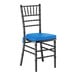 A black wood Chiavari chair with a blue cushion.
