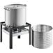 A Backyard Pro Seafood Boiler and Steamer Kit with a large pot and a silver metal basket on a stand.