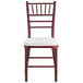 A mahogany Chiavari chair with a white cushion.