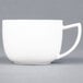 A C.A.C. Collection bright white porcelain coffee cup with a handle.