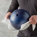 a person wiping a bowling ball