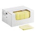 A white box with yellow sheets of Choice Heavy Duty Crumb Snatcher Foodservice Towels.