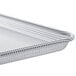 A Baker's Mark aluminum perforated bun pan on a counter.