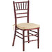 A Lancaster Table & Seating mahogany Chiavari chair with gold cushion.