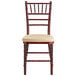 A mahogany Lancaster Table & Seating Chiavari chair with a gold cushion.