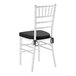 A white wood Chiavari chair with a black cushion tied to the seat.
