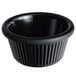 An Acopa black fluted melamine ramekin with a black rim.