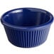 A blue fluted melamine ramekin with a white background.