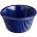 A blue fluted melamine ramekin with a rippled rim.