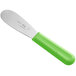 a knife with a green handle