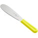 A stainless steel sandwich spreader with a yellow polypropylene handle.