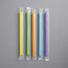 a group of straws in plastic wrappers