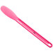 a pink spoon on a white background