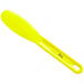A yellow plastic sandwich spreader with a smooth paddle and a handle.