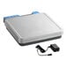 A grey rectangular AvaWeigh digital portion scale with blue buttons and a black cord.