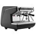 A black and silver Nuova Simonelli Appia Life Compact 2 Group Volumetric Espresso Machine with two coffee cups.