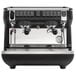 A black and silver Nuova Simonelli Appia Life 2 Group Volumetric Espresso Machine on a counter.