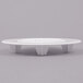 A white round plastic plate with four holes in it.