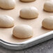 A white tray of six Saf Pro dough balls.