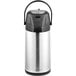 A silver and black Acopa stainless steel airpot with push button.