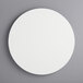 A white circular melamine-coated wood cake board with feet.