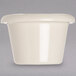 A white Carlisle ramekin with a smooth surface on a white surface.