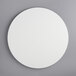 A white circular melamine-coated wood cake board with feet.
