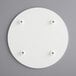 A white circular melamine-coated wood cake board with feet.