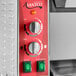 An Avantco commercial bun toaster with red and silver knobs and switches.