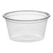A package of Dart clear plastic souffle cups with a clear rim.