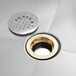 A Regency stainless steel mop sink with a silver and gold drain.