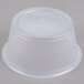 A Dart clear plastic souffle container with a lid.