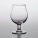 A Pasabahce stemmed beer glass with clear liquid.