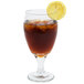 A Libbey tall iced tea glass with brown liquid, ice, and a lemon slice.