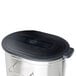 A Bunn stainless steel iced tea dispenser with a lid and handle.