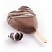A chocolate heart-shaped cake pop on a stick in a Silikomart heart mold.