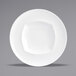 A close-up of a Front of the House bright white porcelain bowl with a wide rim.