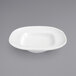 A Front of the House Trillium bright white square porcelain plate with a wide rim on a gray surface.